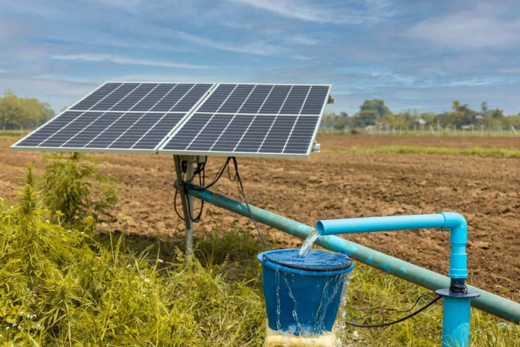 solar powered water pump pumping up water on field